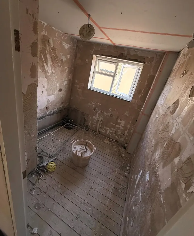 Bathroom stripped back to the old walls before re-plastering
