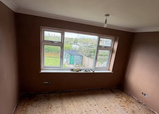 Freshly plastered bedroom with a wide window